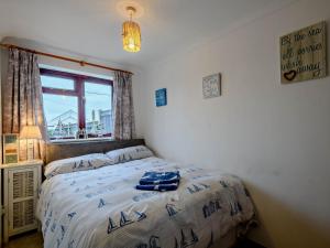 Ένα ή περισσότερα κρεβάτια σε δωμάτιο στο 2 Bed in Walcott 81322