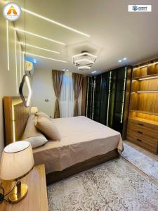 a bedroom with a large bed in a room at Stylish & Trendy in Cairo