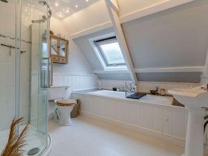 a bathroom with a tub and a sink and a shower at 2 Bed in St Just 85610 in St Just +36 photos