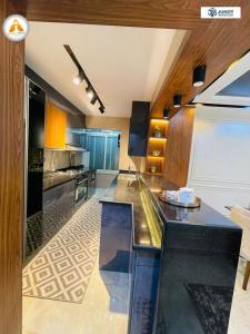 a large kitchen with a counter top in a room at Stylish & Trendy in Cairo