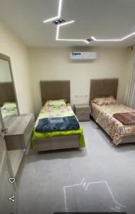 Postel nebo postele na pokoji v ubytování شقق النخبه