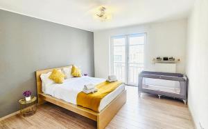 a bedroom with a bed and a television in it at Chic 2BR easy access to the train station-2b in Luxembourg