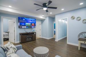 a living room with a couch and a ceiling fan at Cozy 2nd & 3rd Floor Retreat in Lewiston
