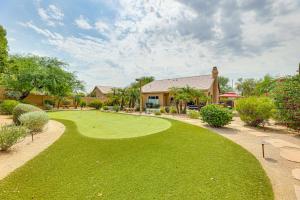 a golf course in front of a house at Putting Green Golfers Getaway in Scottsdale in Scottsdale