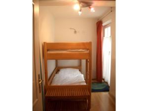 a small room with a bunk bed in it at Holiday apartment Seagull in Bad Saarow