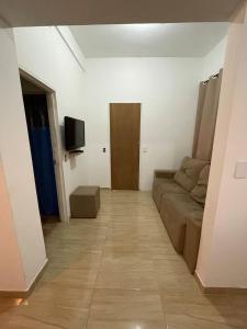 Μια τηλεόραση ή/και κέντρο ψυχαγωγίας στο Casa pequena e aconchegante em Passa Quatro, MG