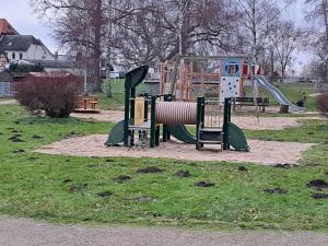 a park with a playground with a slide at Holiday home Neukalen Comfortable holiday residence in Neukalen +9 photos
