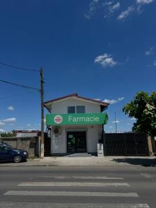 a store with a sign for a farm market at Happy apartment 2 in Chiajna