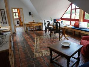 a living room with a table and a dining room at Apartment near Leipzig in Taucha