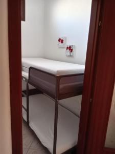Postel nebo postele na pokoji v ubytování Sweet Home Rosa
