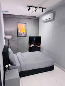 a bedroom with a bed and a desk in it at Nordic Studio I CityCenter I Netflix I AirPurifier I Segi in Subang Jaya +28 photos
