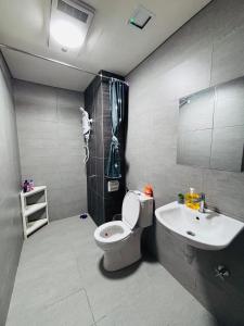 a bathroom with a toilet and a sink at Nordic Studio I CityCenter I Netflix I AirPurifier I Segi in Subang Jaya