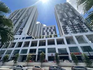 two tall buildings with cars parked in front of them at Nordic Studio I CityCenter I Netflix I AirPurifier I Segi in Subang Jaya