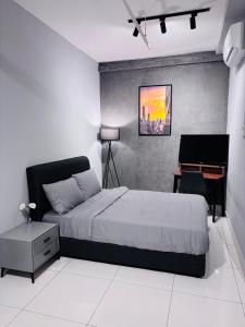 a bedroom with a bed and a desk and a piano at Nordic Studio I CityCenter I Netflix I AirPurifier I Segi in Subang Jaya