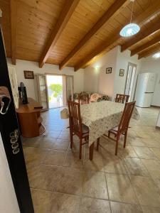 a dining room with a table and chairs in a room at Giulio's House in Alghero