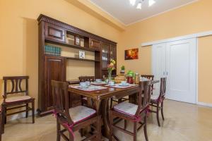 a dining room with a wooden table and chairs at Selene BeB in Casalbordino