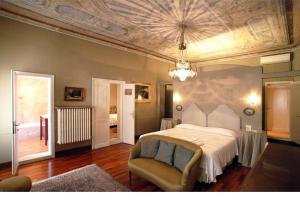 Ένα ή περισσότερα κρεβάτια σε δωμάτιο στο Cà Satriano