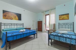 a bedroom with two beds in a room at Selene BeB in Casalbordino