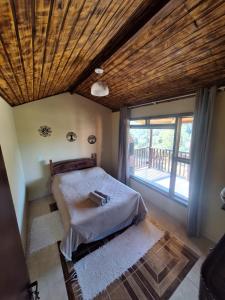 Ένα ή περισσότερα κρεβάτια σε δωμάτιο στο Casa do vadinho