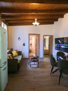 a living room with a couch and a table at Domus Fidias in Rhodes Town
