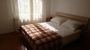 Postel nebo postele na pokoji v ubytování Apartments Luka