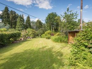 a field of grass with trees in the background at 3 Bed in Braithwaite SZ045 in Braithwaite