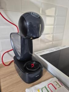 a black blender sitting on top of a table at La Blétoise in Blet