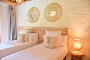 Postel nebo postele na pokoji v ubytování Hotel Ak'Na Holbox