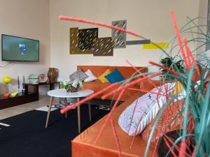 a living room with a couch and a table at Villa Oni in Tirana