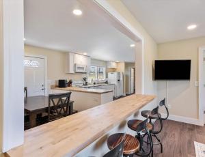 a kitchen with a large wooden counter top in a room at Diana's Place - 6 BDR Ranch Long or Short Stays in Murfreesboro +23 photos