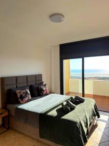 Una cama o camas en una habitación de appartement avec vue panoramique