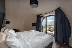 Postel nebo postele na pokoji v ubytování Hotel Qvevrebi