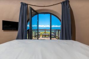 Postel nebo postele na pokoji v ubytování Hotel Qvevrebi