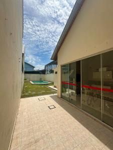 a building with large glass windows and a patio at Espacioso Departamento Céntrico in Formosa