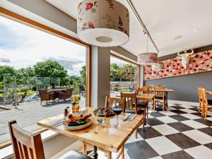 a dining room with a checkered floor at 2 Bed in Westward Ho 41865 in Westward Ho