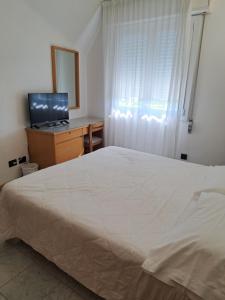 Postel nebo postele na pokoji v ubytování Hotel Consuelo