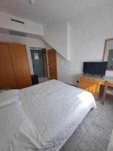 Postel nebo postele na pokoji v ubytování Hotel Consuelo
