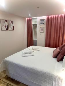 a bedroom with a bed with two towels on it at Lucky Home Chios in Chios