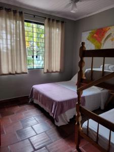 Ένα ή περισσότερα κρεβάτια σε δωμάτιο στο Pousada Cantinho D´Lilica