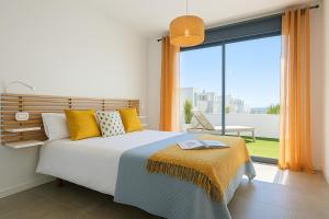 Posteľ alebo postele v izbe v ubytovaní Apartamento Seascape. Relax, lujo y vistas al mar.
