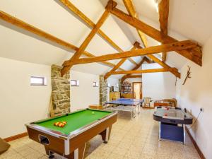 a room with a pool table and two tables at 1 Bed in Barmouth 89777 in Dyffryn
