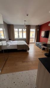 a large bedroom with a bed and a large window at Poziom Morza in Gdynia