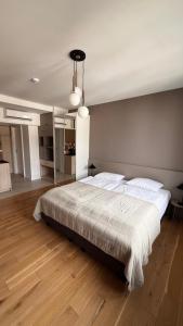 a bedroom with a large bed in a room at Poziom Morza in Gdynia