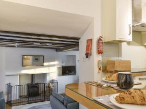 a kitchen with a counter with some food on it at New Cottage in Egton