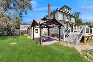 a backyard with a picnic table and a gazebo at Salt Air Serenity in Old Orchard Beach
