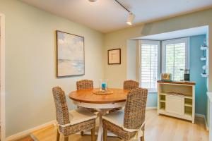 a dining room with a wooden table and chairs at 1641 Courtside in Seabrook Island
