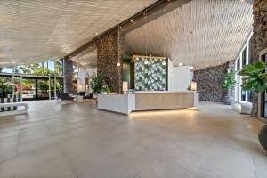 a lobby of a hotel with a reception desk at Humphreys Half Moon Inn in San Diego