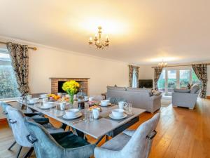 a dining room with a table and chairs at 4 Bed in Westward Ho 91814 in Northam