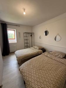 Ένα ή περισσότερα κρεβάτια σε δωμάτιο στο Appartement 80m2 3 chambres 5 lits