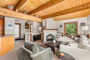 a living room with a couch and a fireplace at Shadow Mountain 10 in Aspen